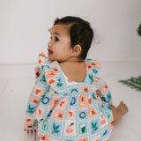 Leah Romper in Holiday Stamps
